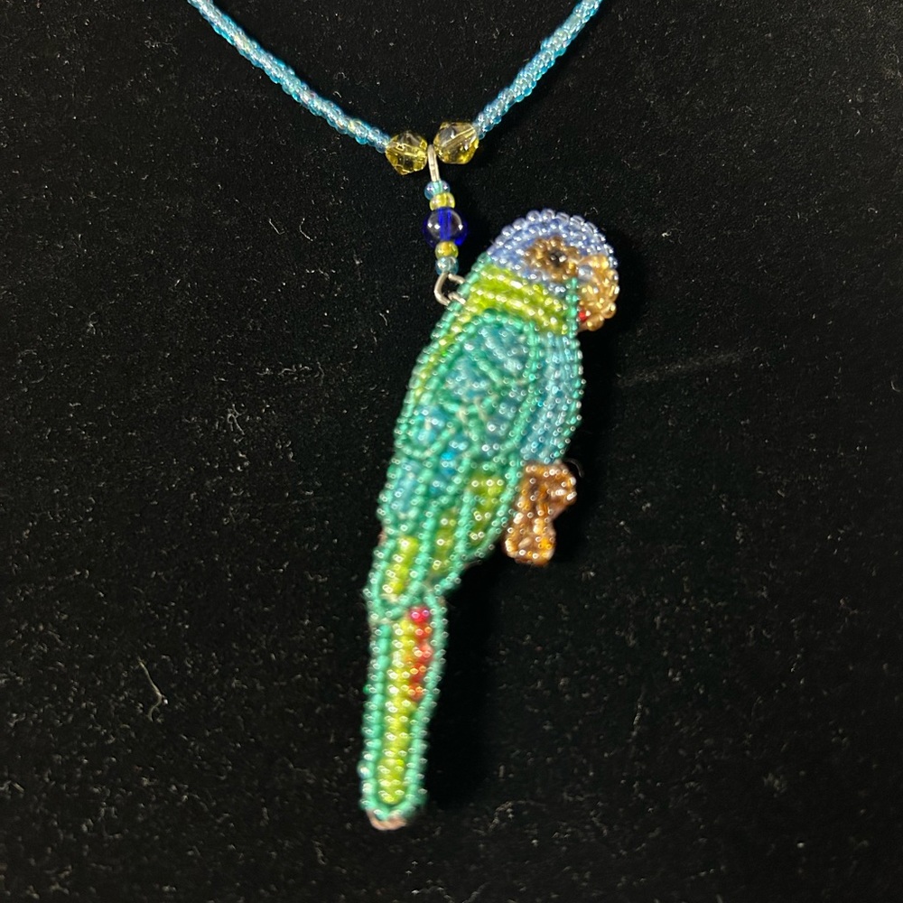 Vintage handmade beaded parrot necklace . Colors blue , green